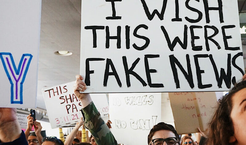 people protesting fake news