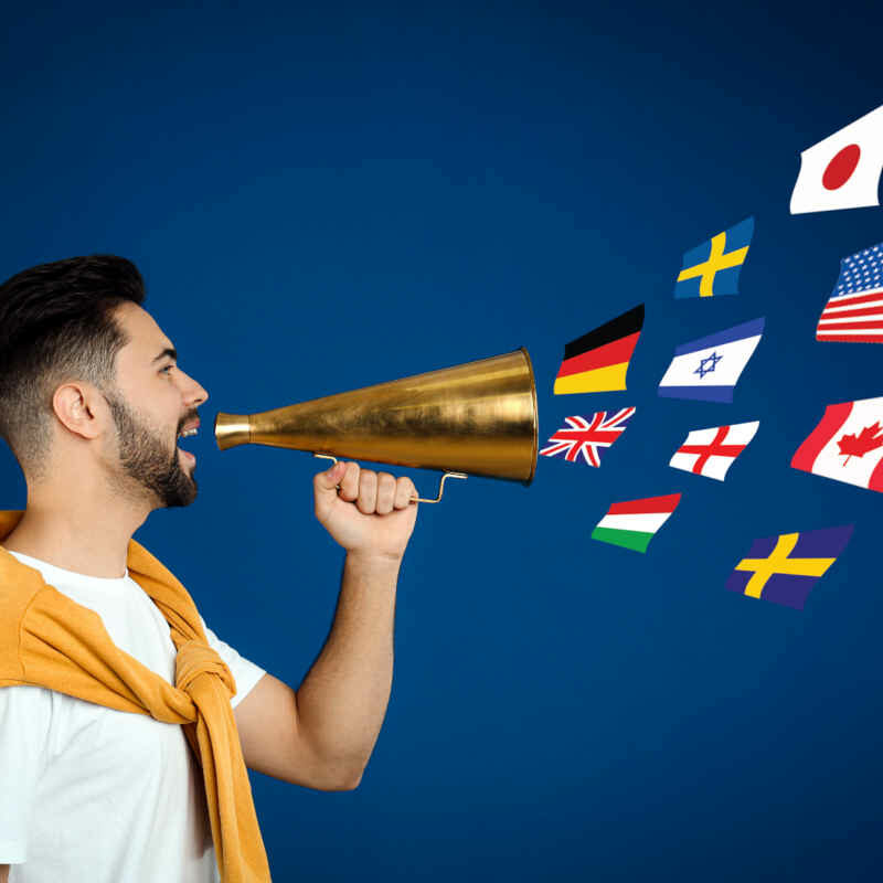 Man with a megaphone speaking in different languages