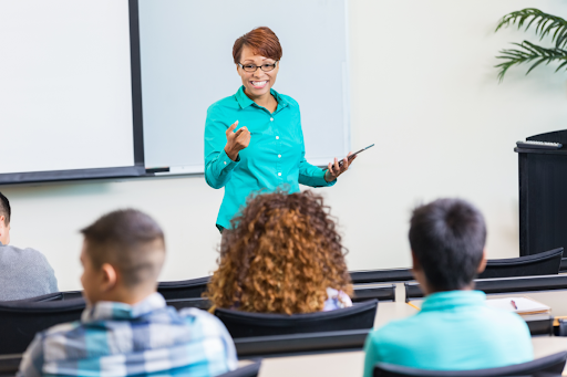 A digital marketing instructor lecturing in front of a class.